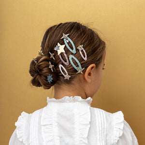 festive ribbon wrapped clic-clacs with glitter christmas trees and stars from mimi & lula for kids/children