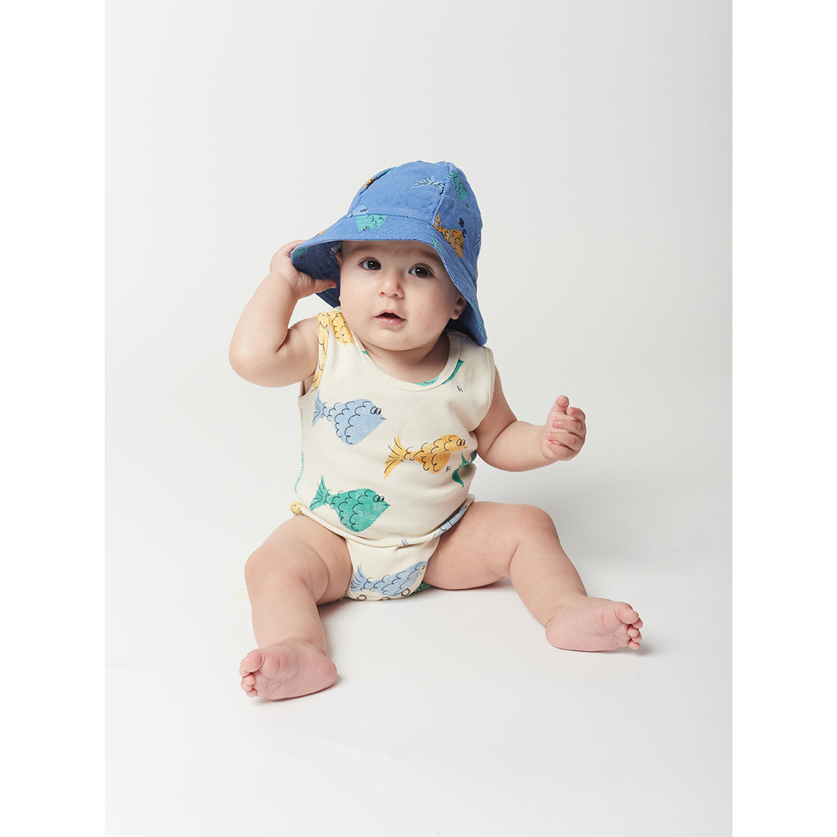 white sleeveless body with green, yellow and blue fish all over print in a slim fit and with crotch snap fastening from bobo choses for newborns and babies