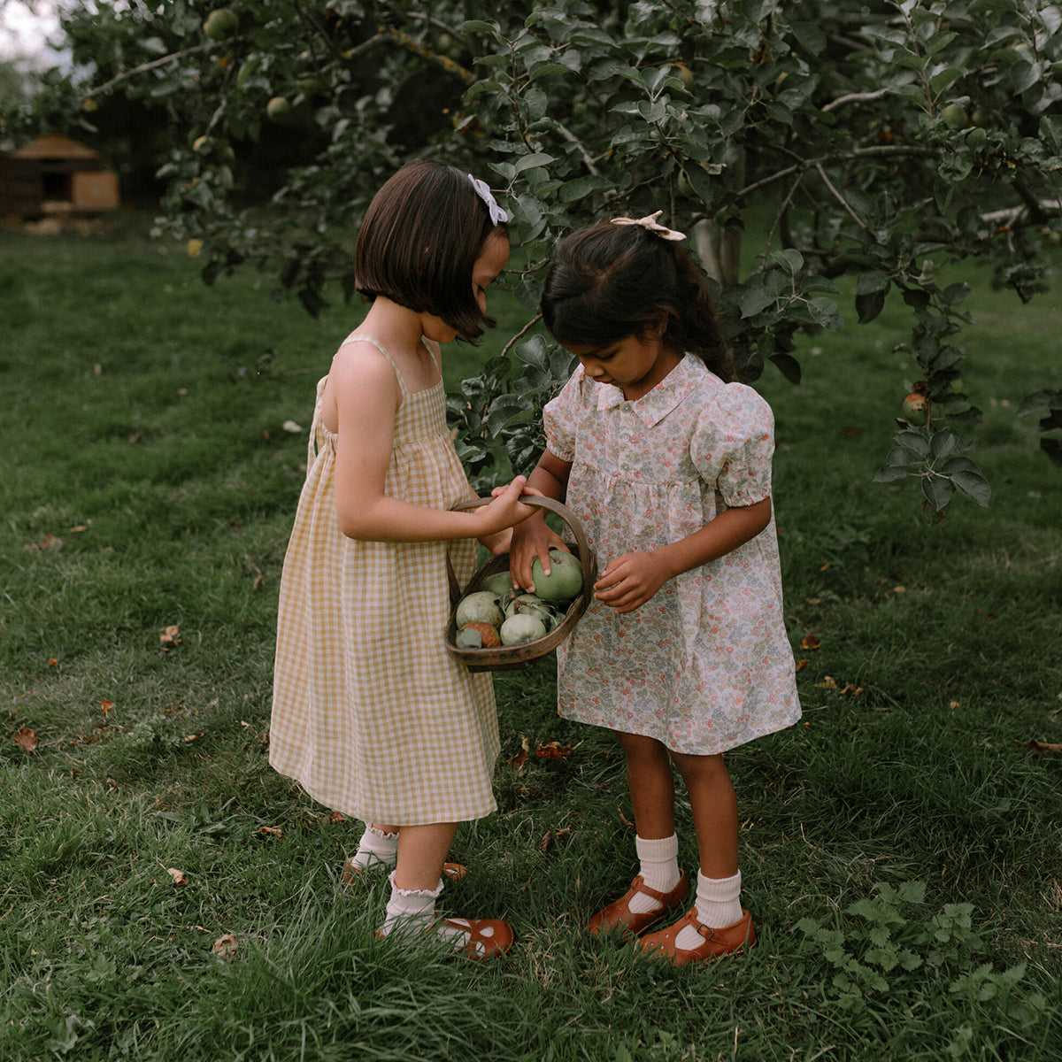 yellow and white floaty midi dress with adjustable straps from nellie quats for toddlers and kids