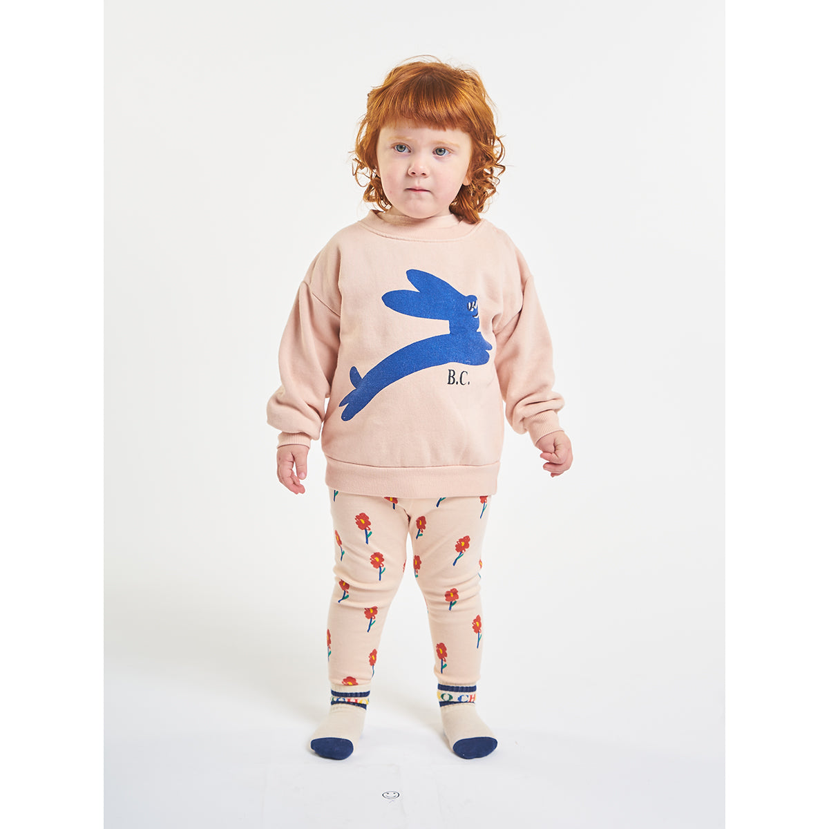 pink leggings with red flowers all over print made from organic cotton and Elastane made in spain from bobo choses for babies and toddlers