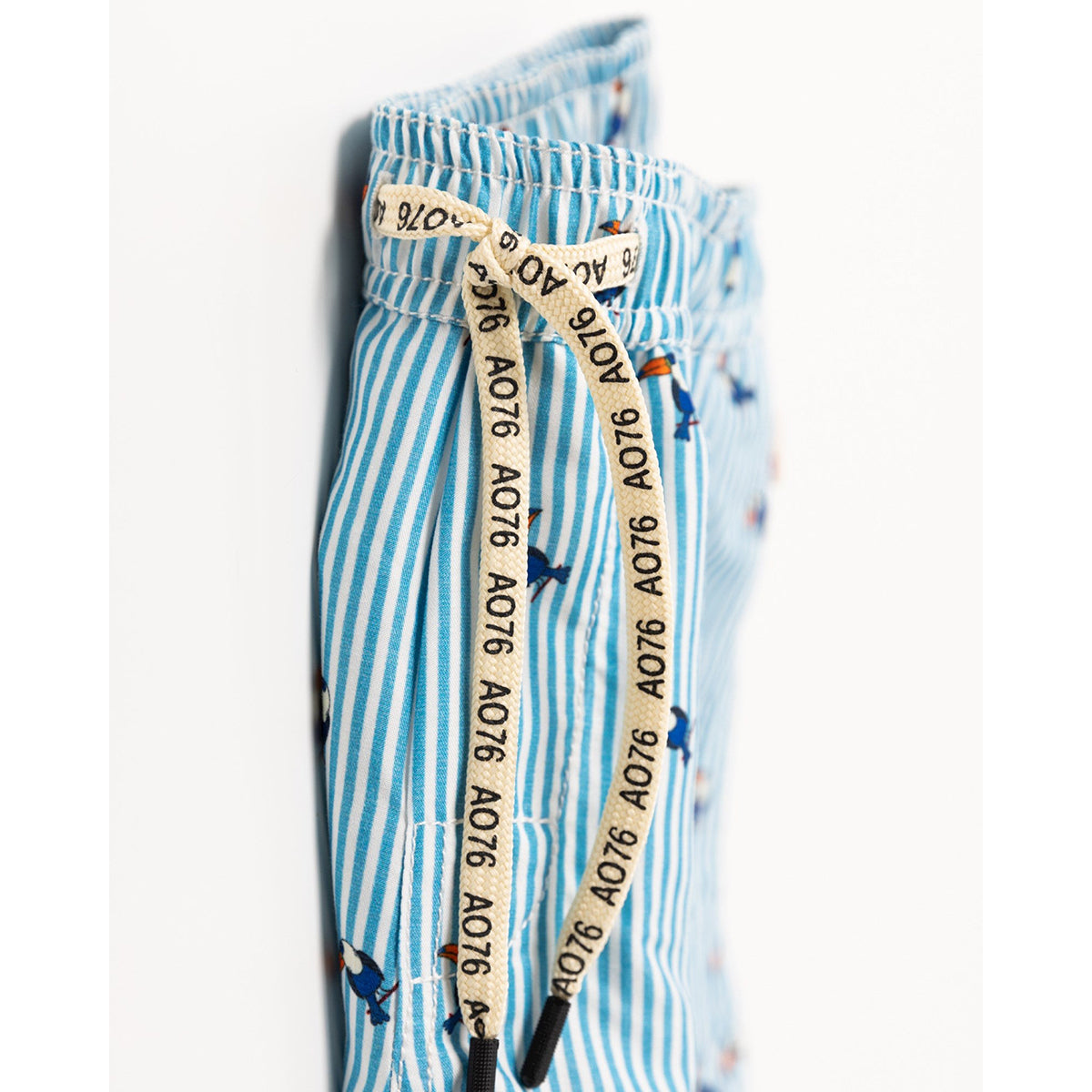 blue and white stripes on toucan swim shorts with drawcord in the colour multicolour from ao76 for kids and teens
