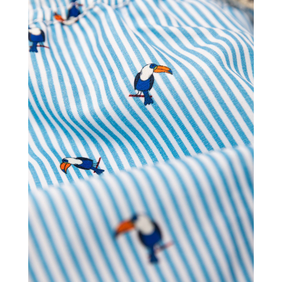 above knee length swim shorts in polyester with toucans print from ao76 for kids and teens