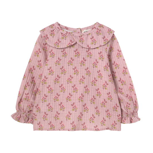 Verona Blouse from Cozmo. Long-sleeved blouse in pink with all-over floral print. Smocked cuffs and a double-layered crossover collar.