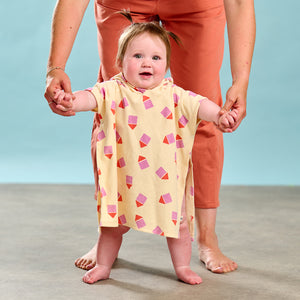 The Bonnie Mob Surfer Hooded Towelling Robe with pink beach hut print for babies and toddlers