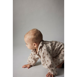 Cozmo Lucia Romper with a flounce-trimmed Peter Pan collar for babies