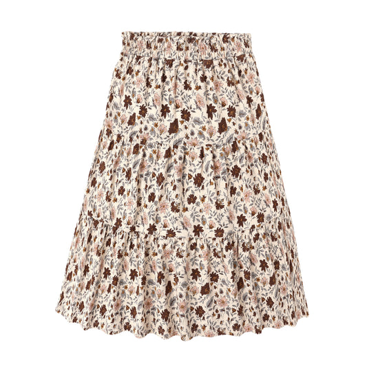 Product picture of a ruffled tiered midi skirt from Rylee + Cru with all-over floral print in muted red/brown, pink, yellow and blue colours on a light beige background