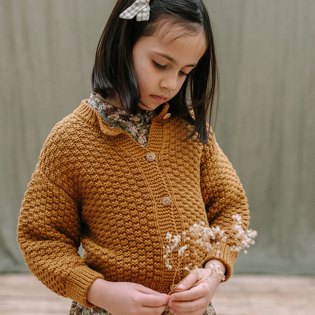 Nellie Quats Twister Cardigan Mustard for toddlers and kids/children