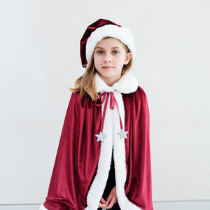 Mimi & Lula Santa Cape with popper button closure with red grosgrain ribbon tie featuring padded silver star charms