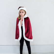 Load image into Gallery viewer, Mimi &amp; Lula Santa Cape with popper button closure with red grosgrain ribbon tie featuring padded silver star charms