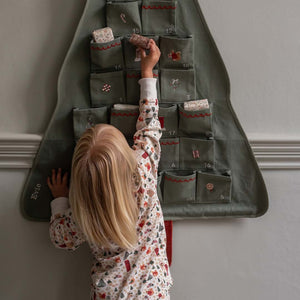 Avery Row Advent Calendar - Festive Forest hanging on the wall