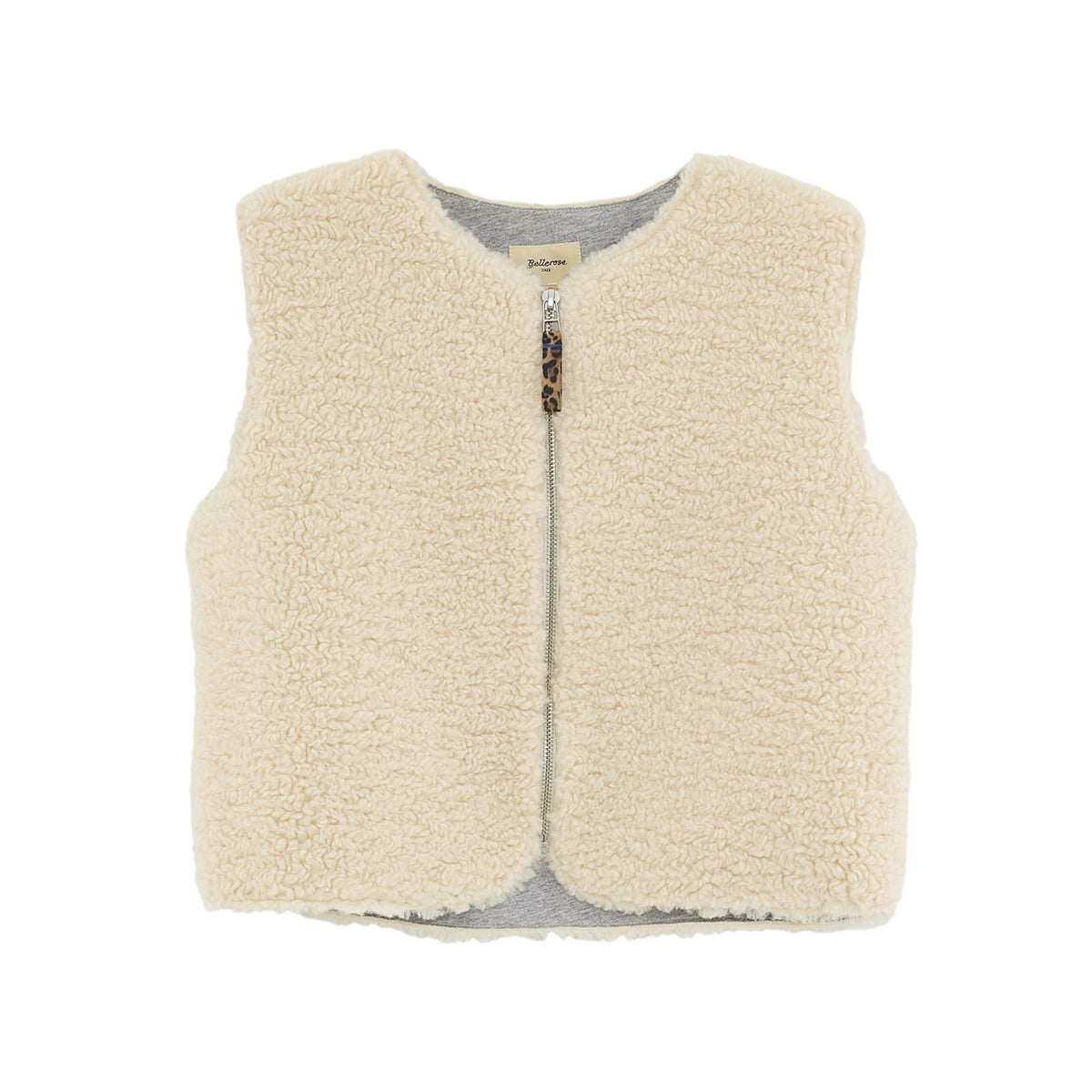 Product picture of Jams Bodywarmer front side from Bellerose. Bodywarmer is sleeveless, made from off-white teddy, featuring a light grey fleece lining and has a front zipper closure.