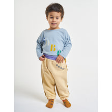 Load image into Gallery viewer, Bobo diagonal long sleeve t-shirt in a loose fit with a front print and shoulder snap fastening from bobo choses for babies and toddlers
