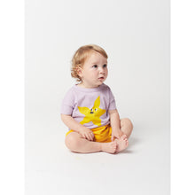 Load image into Gallery viewer, yellow starfish print on front on a lavender t-shirt with short sleeves and dropped shoulder and shoulder snap fastening from bobo choses for babies and toddlers