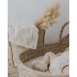 tricot knit blanket with embroidered finishes from búho made in portugal from organic cotton with portuguese yarn