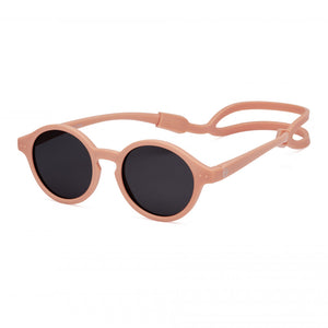 sunglasses in the colour apricot with polarized grey lenses, offers maximum protection while respecting natural colours for babies, toddlers, kids from Izipizi