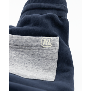Ethan Colour Sweater Pants in navy blue with a big grey back pocket from ao76 for kids/children and teens/teenagers