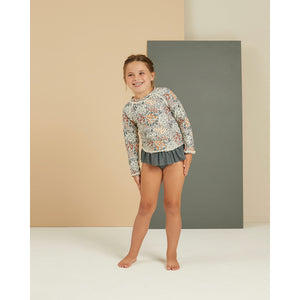 UPF 50+ rash guard top in the colour flower field/floral print and ruffle bikini bottoms in the colour sea/blue from rylee + cru for babies, toddlers, kids