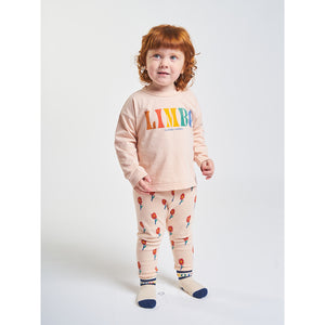 leggings in a peach colour with red flowers all over print from bobo choses for babies and toddlers