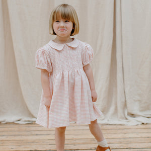 pink and white gingham draughts dress with Mother of pearl buttons down the back yolk for kids/children from nellie quats