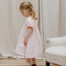 Load image into Gallery viewer, soft pink check linen cat&#39;s cradle dress in the colour powder pink check from nellie quats for toddlers, kids/children