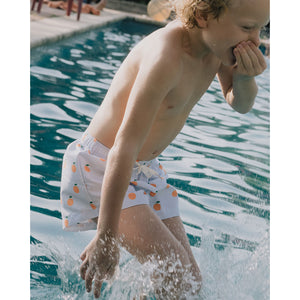 swimming trunks for kids with an orange print from tiny cottons