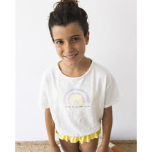 Load image into Gallery viewer, white short-sleeved T-Shirt with elasticated bottom and the front has a pastel rainbow print and the words &#39;love is in the air&#39; print from búho for toddlers and kids/children