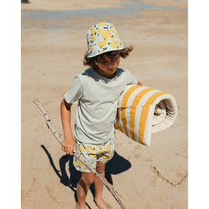 lemon print swimsuit/swim shorts with adjustable drawstring and a back pocket from búho for toddlers and kids/children