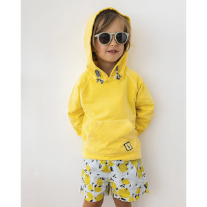 lemon print swimsuit/swim shorts with an elasticated waistband from búho for toddlers and kids/children