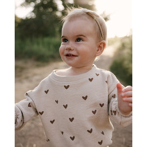 Stretchy, spongey knit Slouchy Pullover sweatshirt for newborns, babies, toddlers and kids with a hearts all-over print from rylee + cru